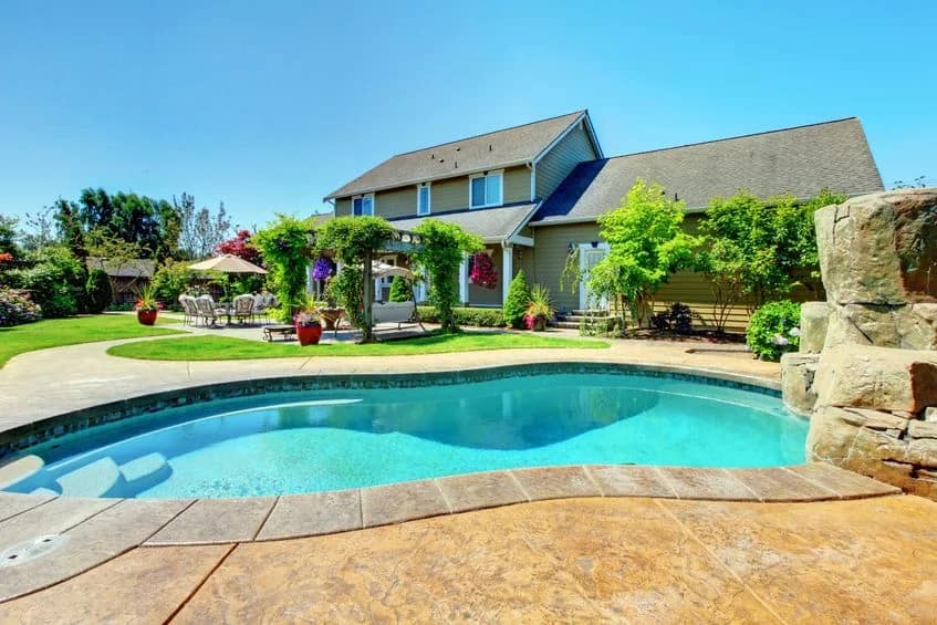 13166562 - american country farm luxury house with porch and beautiful flowers.